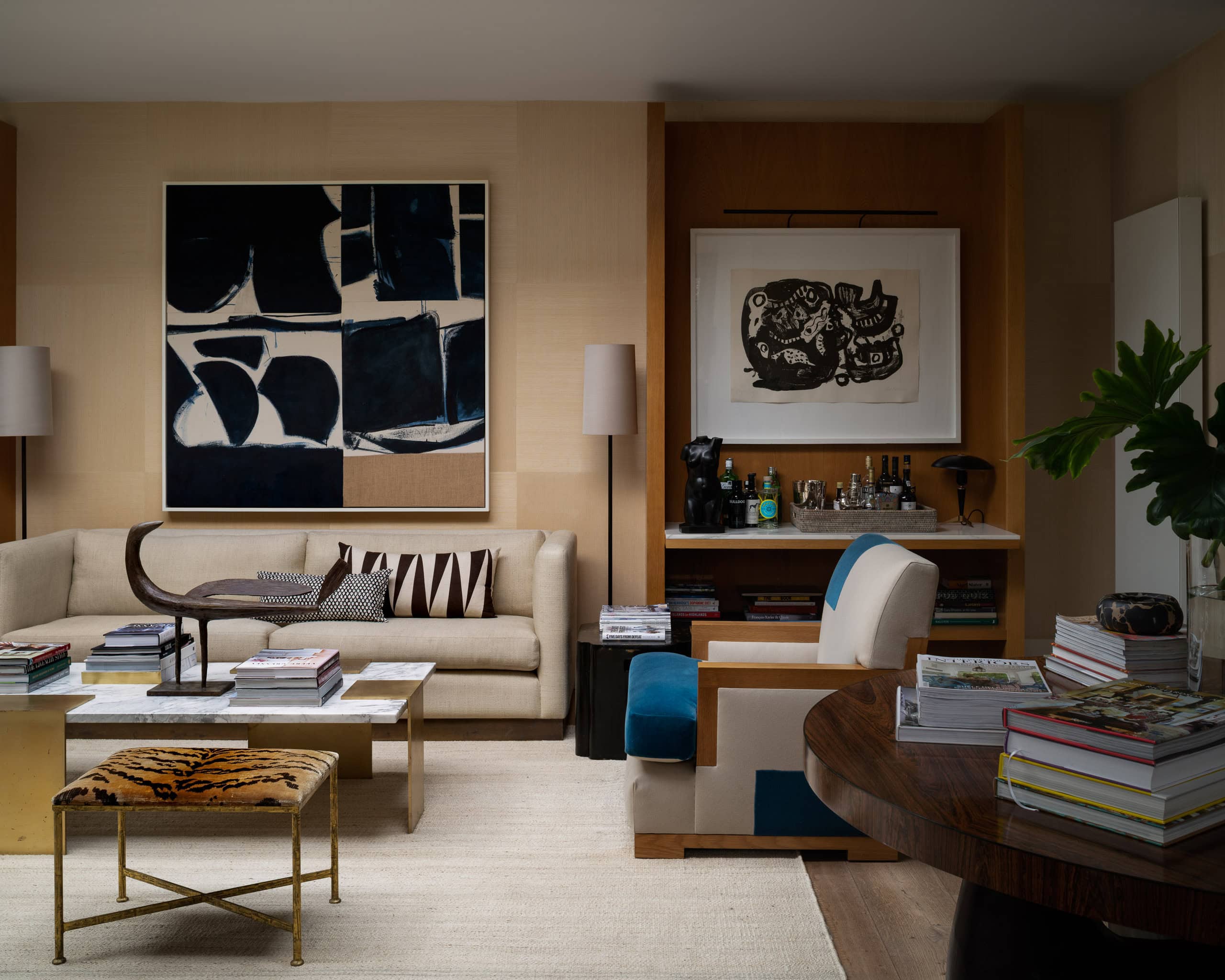 Elegant modern living room with contemporary art, comfortable seating, and stylish decor