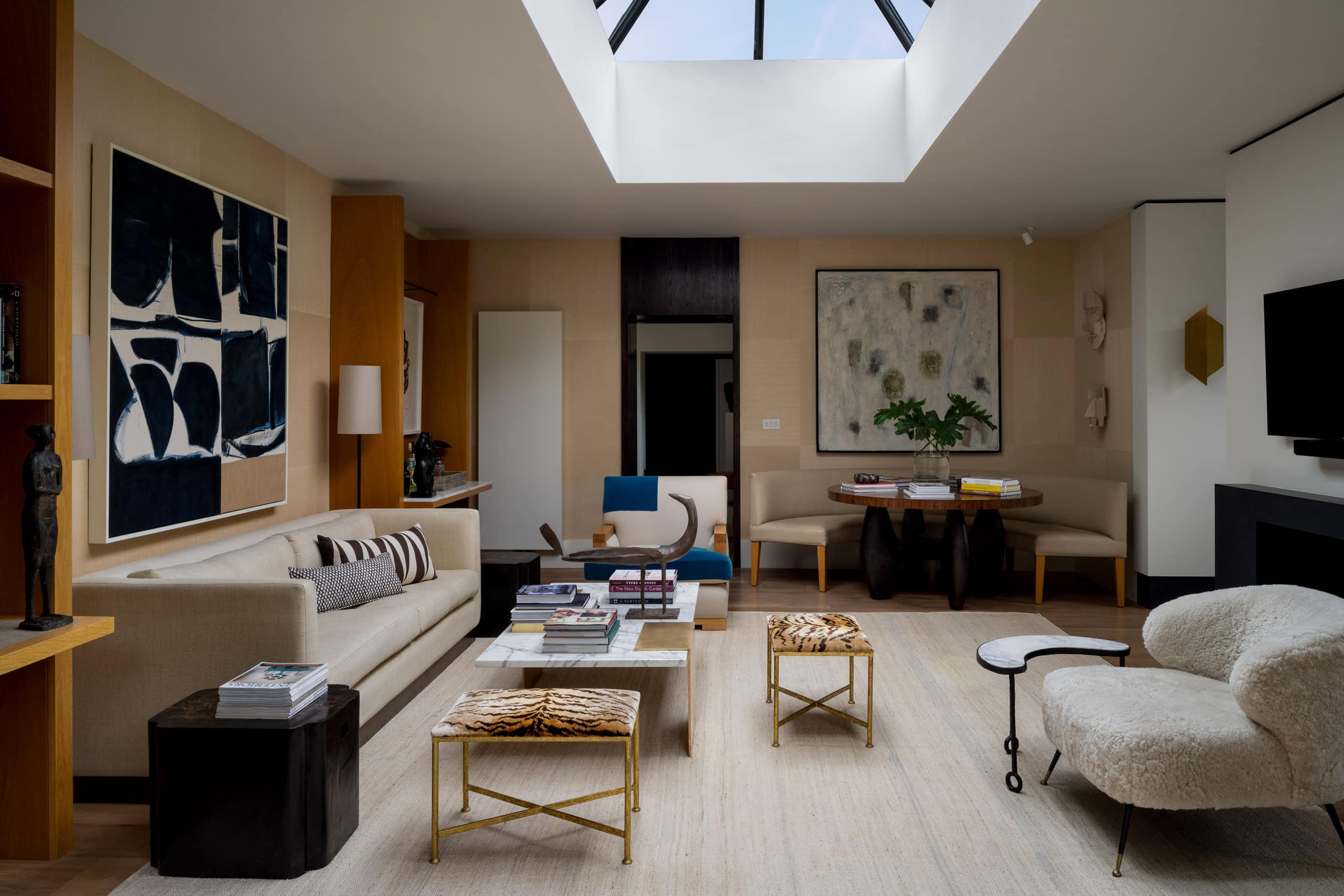 A comfortable modern living room with natural sky light and contemporary decor.