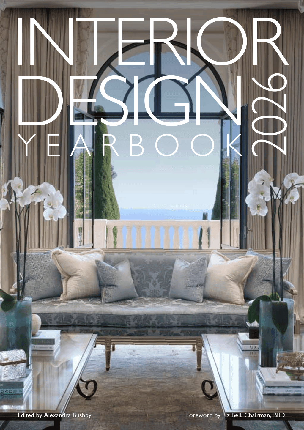 Interior Design year Book 2026 with elegant coastal interior design with ocean view, stylish sofa, and floral decor for luxurious living.