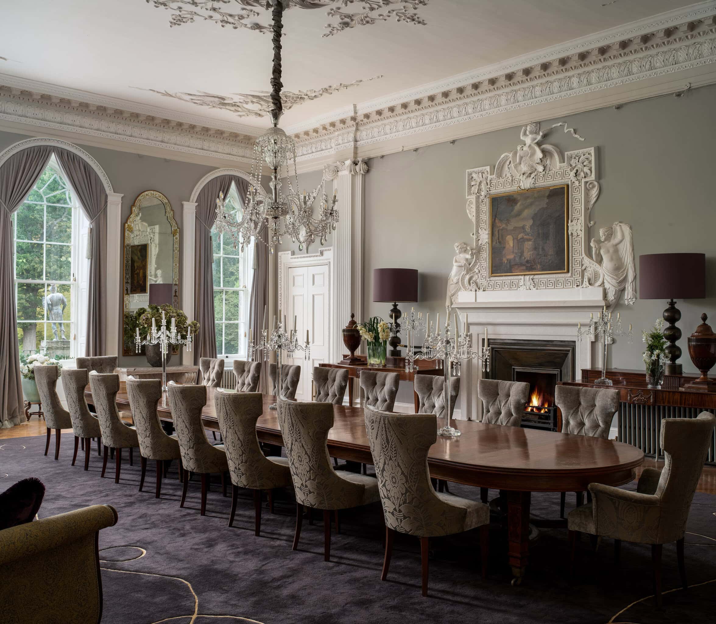 Elegant dining room with ornate decor, large windows, and a grand chandelier. Perfect for luxurious.
