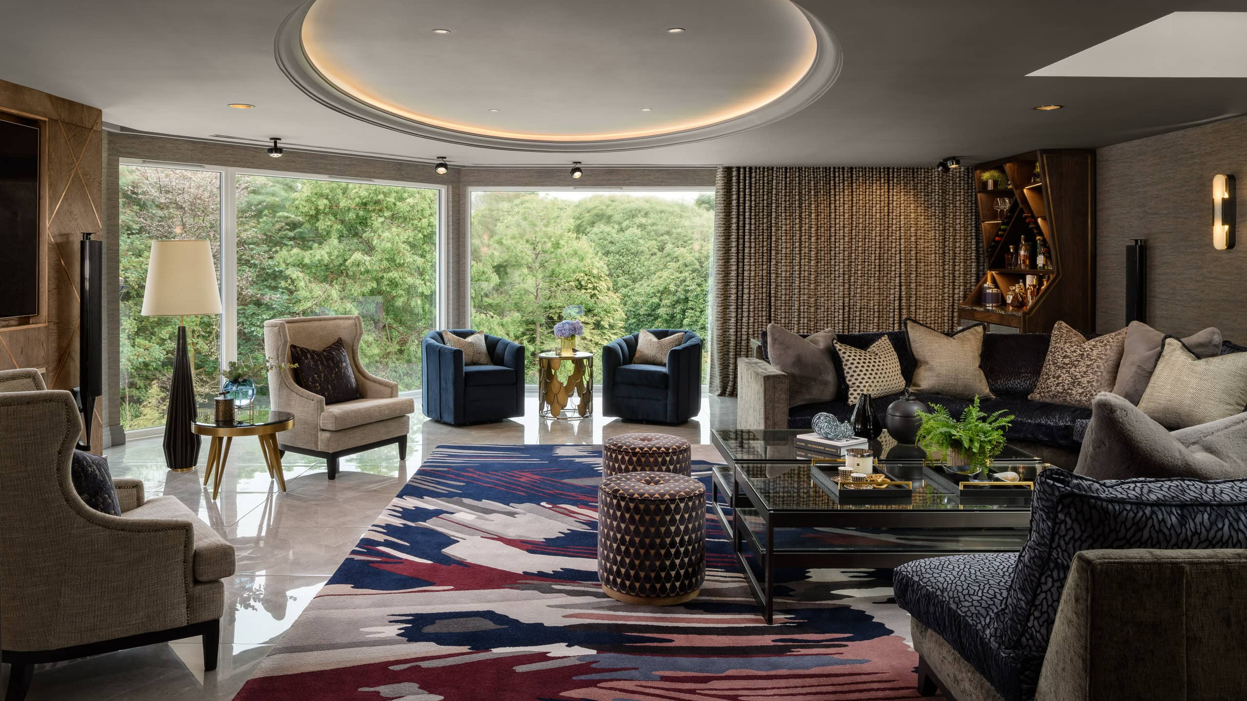 Luxurious modern living room with large windows and stylish furniture.