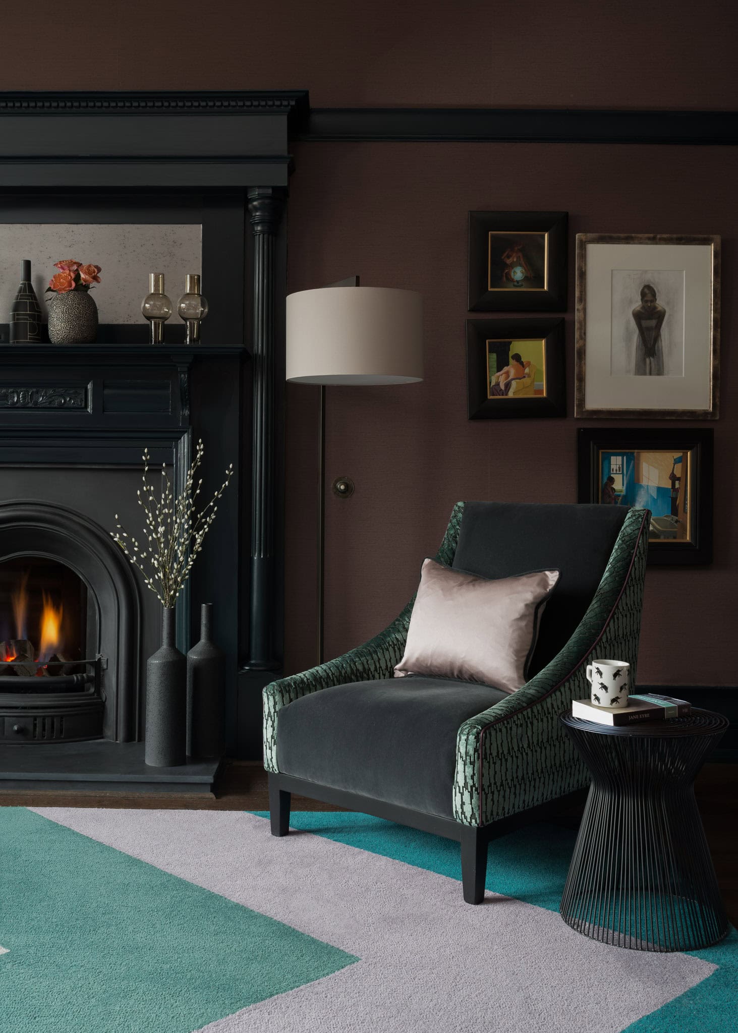 Elegant living room with dark walls, fireplace, and modern decor.