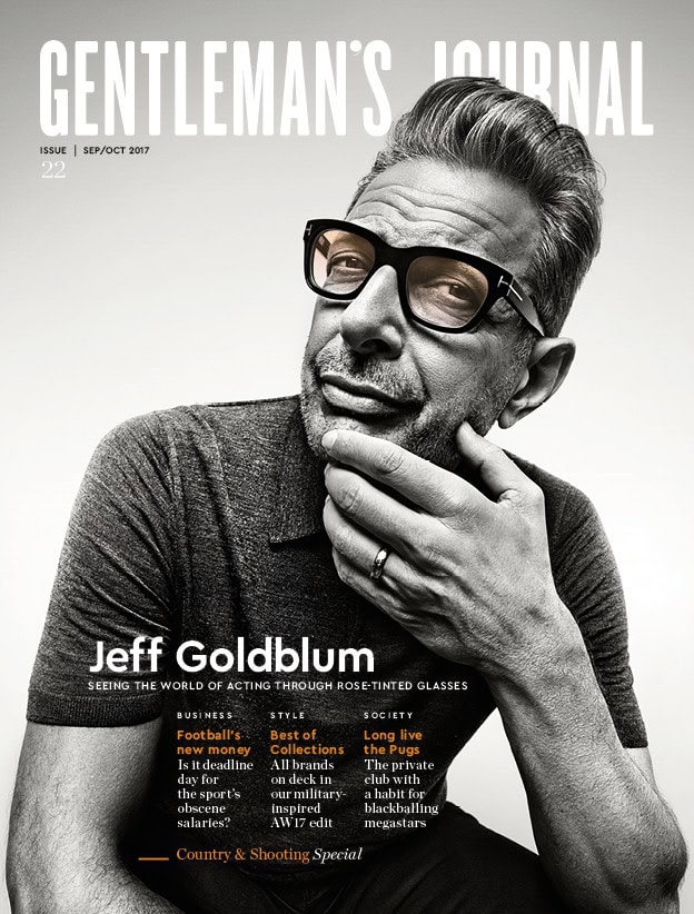Stylish man with glasses on the cover of Gentleman's Journal magazine.