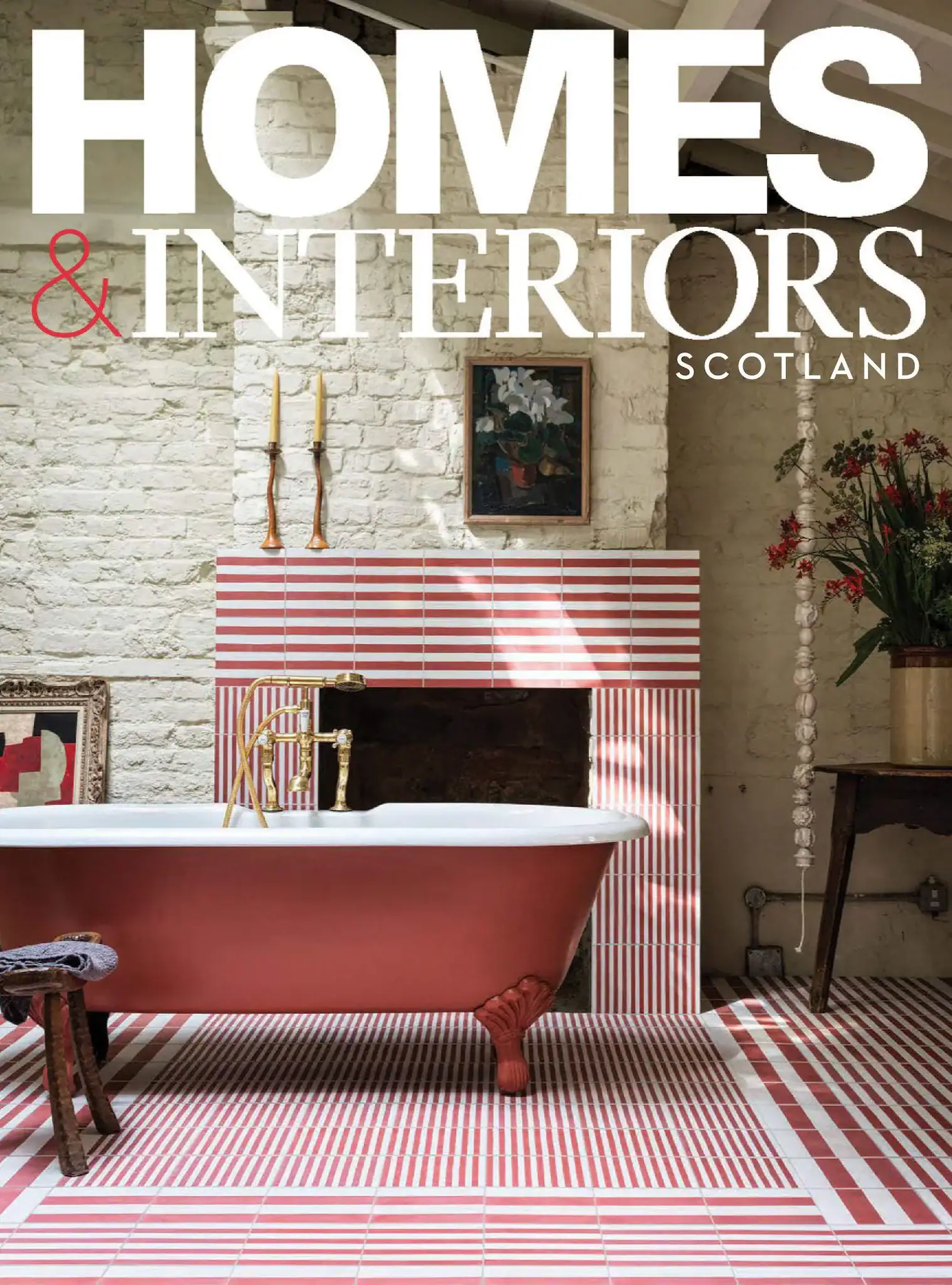 Interior of a vintage-style bathroom with a clawfoot tub and striped tiles.