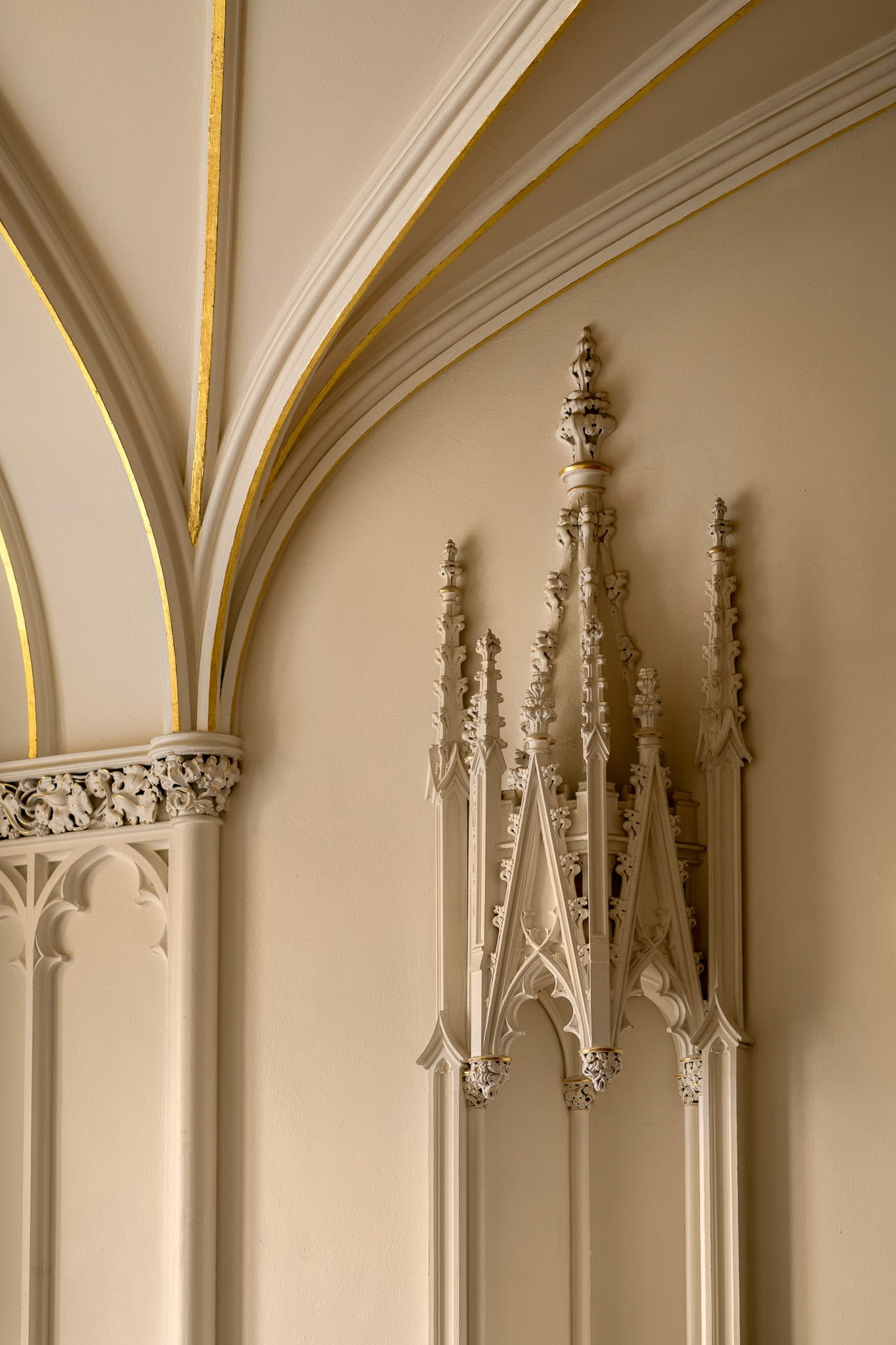 Intricate Gothic architectural details in a historic building interior.